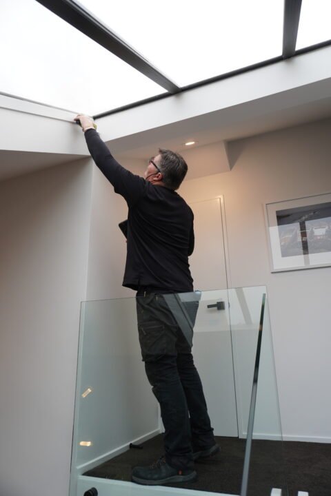 Building inspector performing a moisture test to detect hidden leaks.