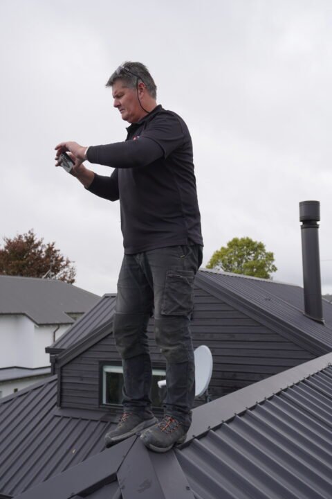 Certified building inspector checking roof integrity.
