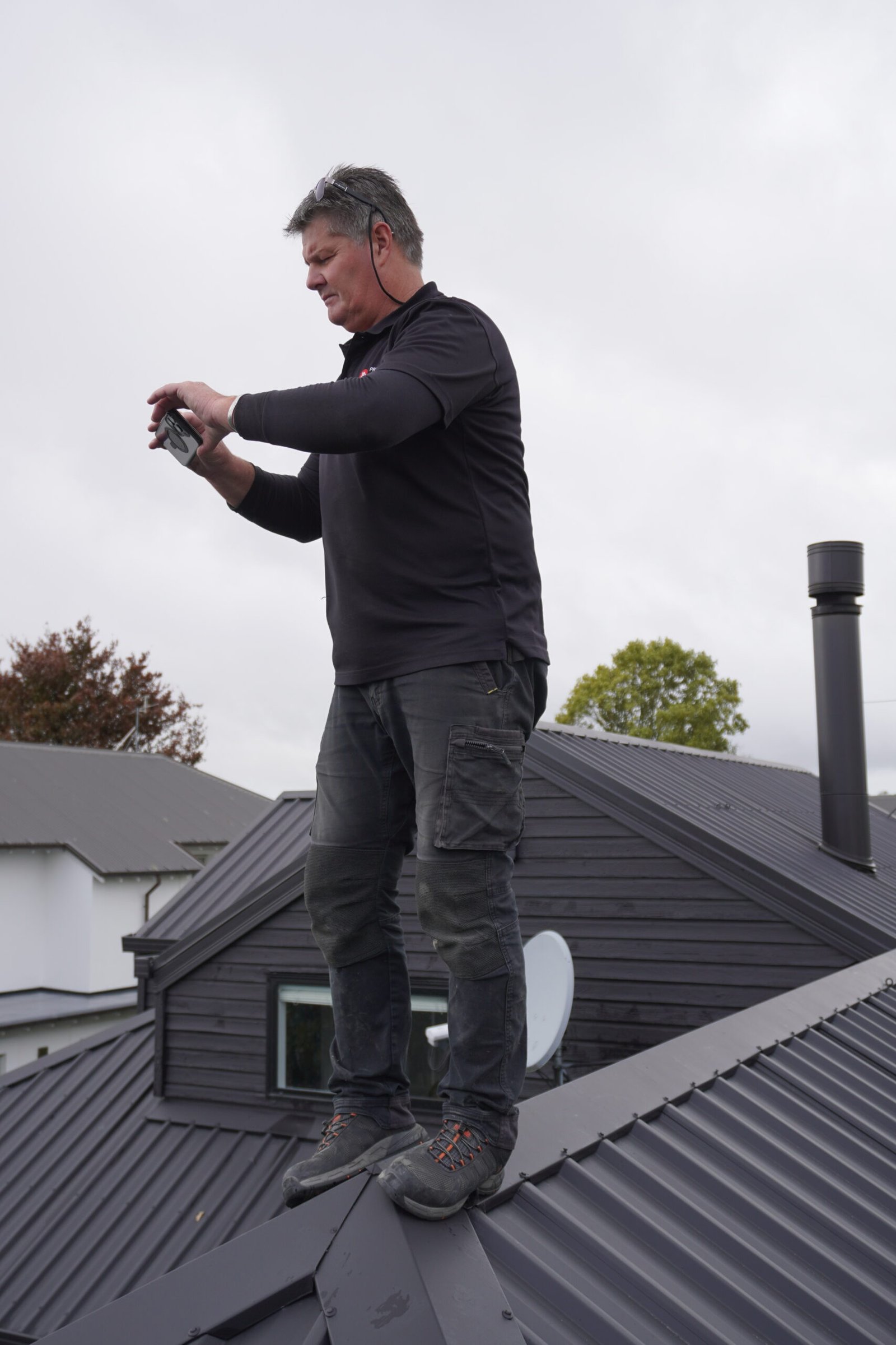 Certified building inspector checking roof integrity.